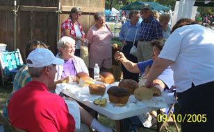 A gathering of people enjoy themselves at the Bread Fest. Click the photo to see a closer view.